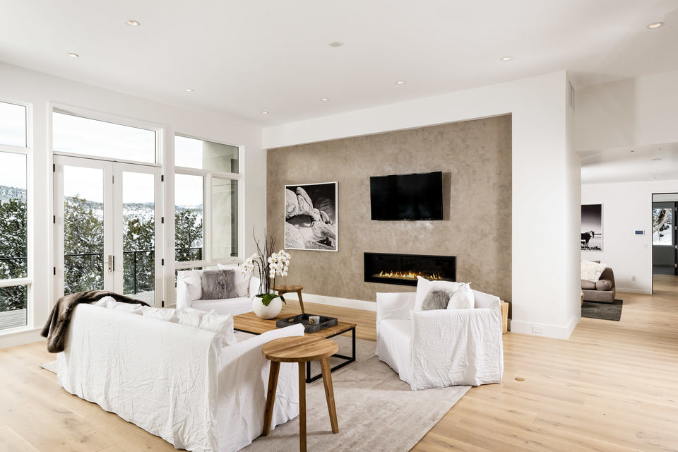 living room with white seating and fireplace